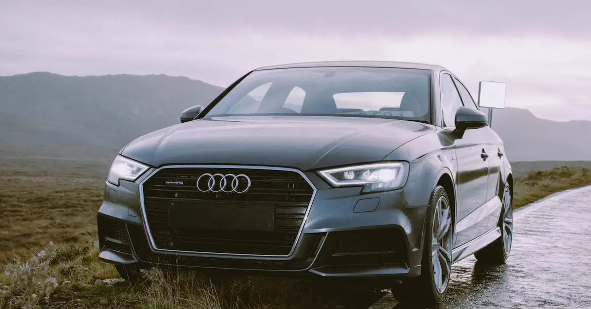 Elegant grey Audi sedan parked roadside, showcasing luxury automotive design against a scenic backdrop.